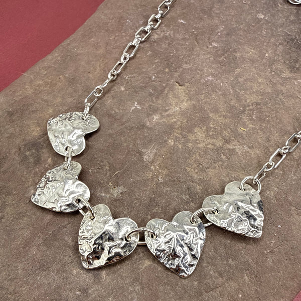 Five reticulated heart necklace
