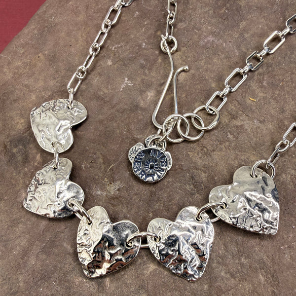 Five reticulated heart necklace