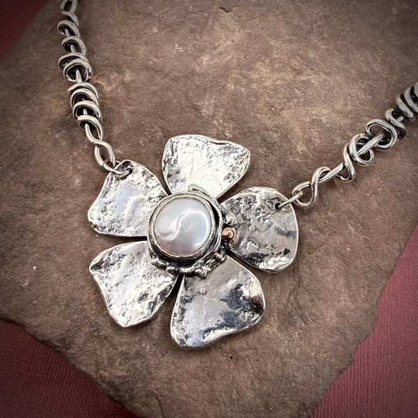 Heavy wrap vine necklace with large flower, pearl, and rose gold ball.