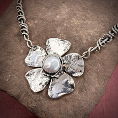 Heavy wrap vine necklace with large flower, pearl, and rose gold ball.