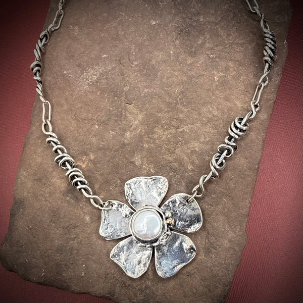 Heavy wrap vine necklace with large flower, pearl, and rose gold ball.