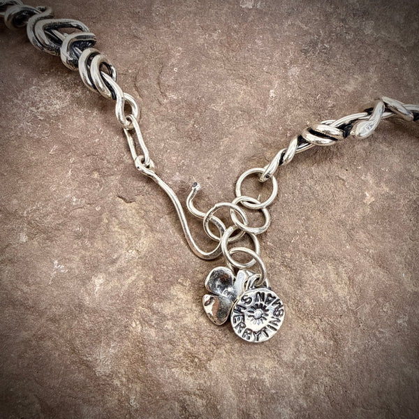 Heavy wrap vine necklace with large flower, pearl, and rose gold ball.
