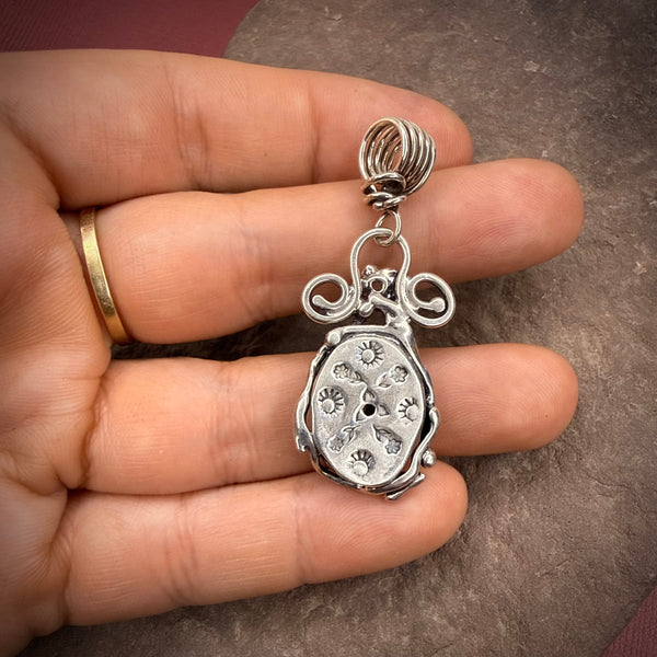 turquoise pendant with elaborate vines