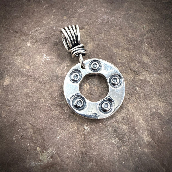Stamped circle pendant