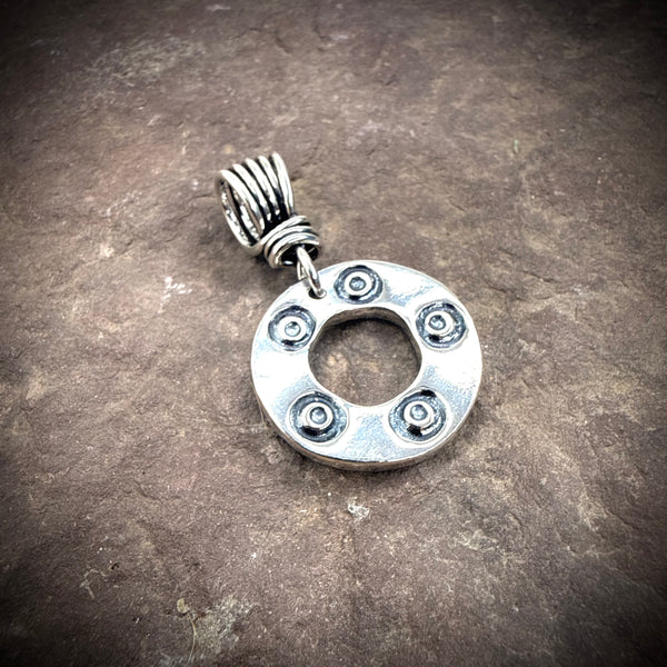 Stamped circle pendant
