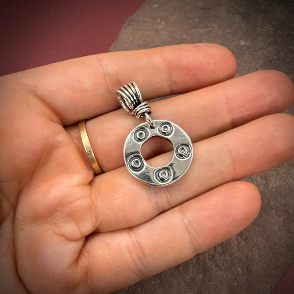 Stamped circle pendant